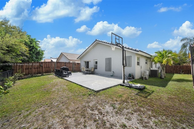 back of property featuring a fenced backyard, central air condition unit, a lawn, stucco siding, and a patio area