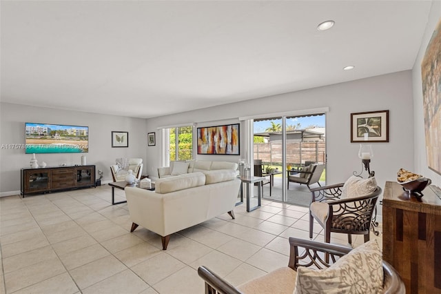 living room featuring recessed lighting, light tile patterned flooring, and baseboards