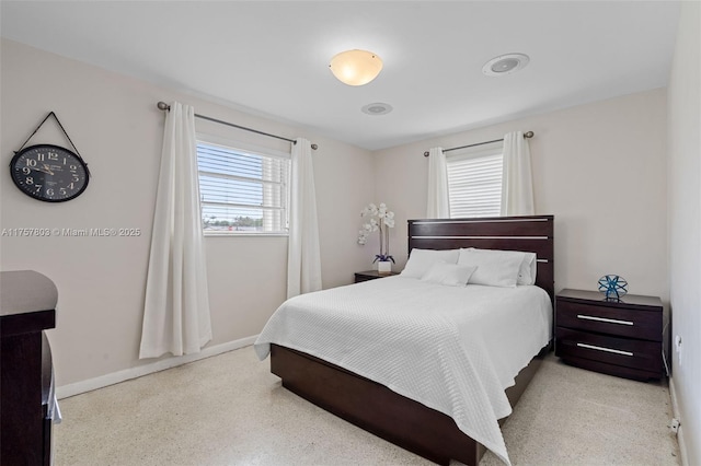 bedroom featuring baseboards