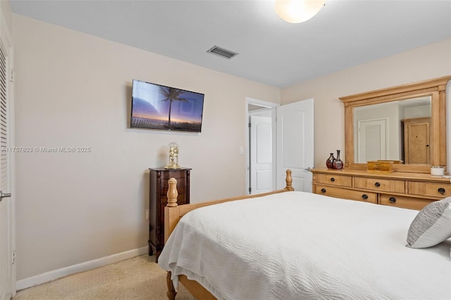 bedroom featuring light carpet, baseboards, and visible vents