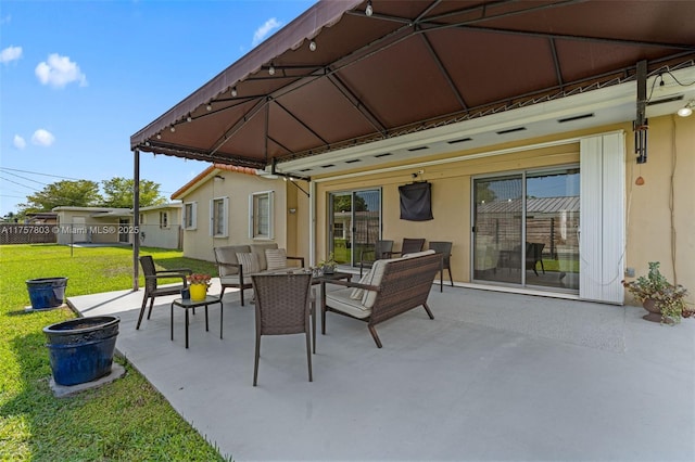 view of patio with a gazebo and outdoor lounge area