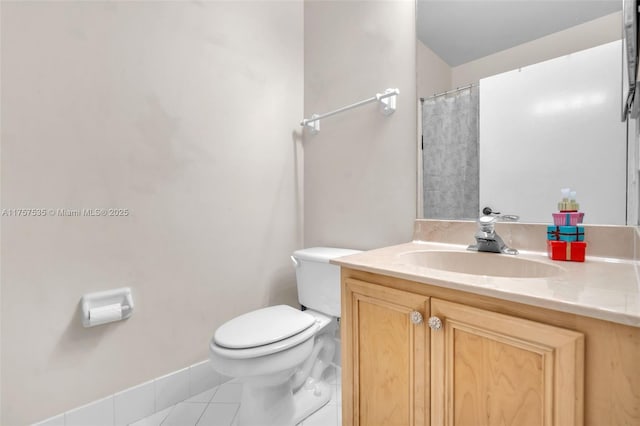 bathroom featuring vanity, toilet, and tile patterned floors