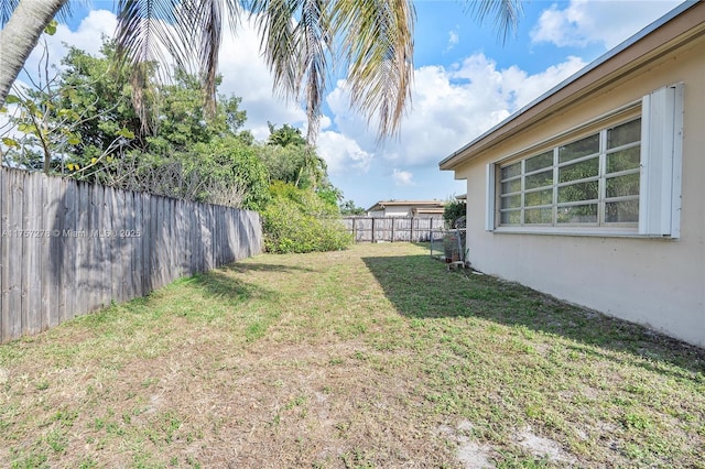 view of yard with a fenced backyard