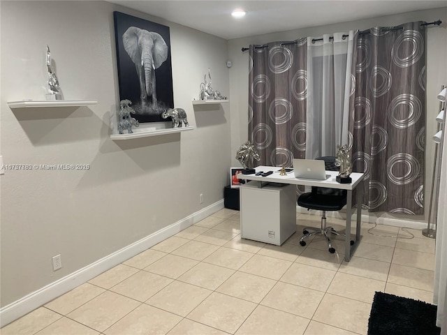 office featuring baseboards and tile patterned floors