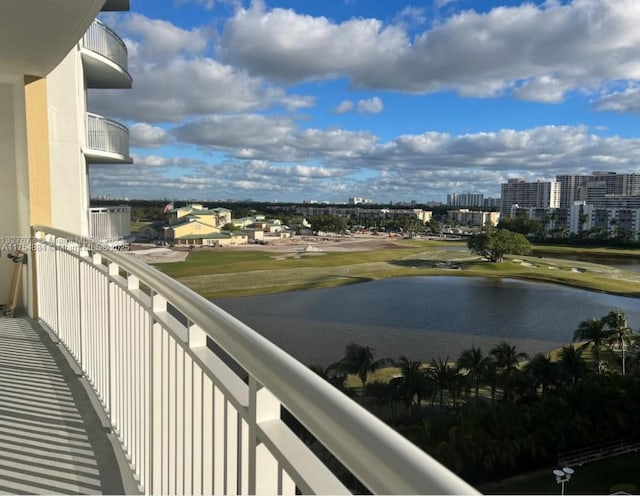 balcony with a view of city and a water view