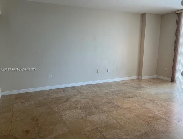 1745 E Hallandale Beach Blvd Unit 804W, Hallandale Beach, FL 33009 - unfurnished room with baseboards and light stone finish flooring