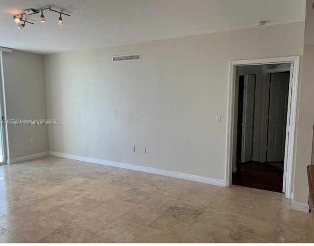 1745 E Hallandale Beach Blvd Unit 804W, Hallandale Beach, FL 33009 - spare room featuring baseboards and a smoke detector