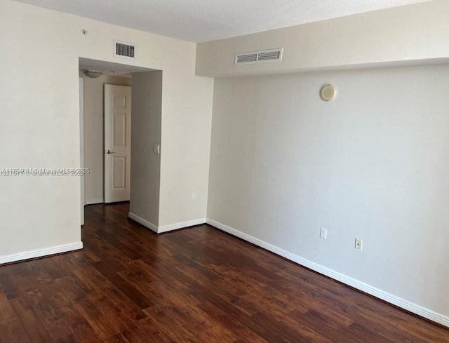 1745 E Hallandale Beach Blvd Unit 804W, Hallandale Beach, FL 33009 - spare room with dark wood-type flooring and baseboards