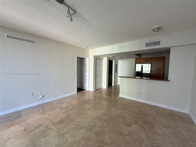 1745 E Hallandale Beach Blvd Unit 804W, Hallandale Beach, FL 33009 - unfurnished room featuring baseboards and a textured ceiling