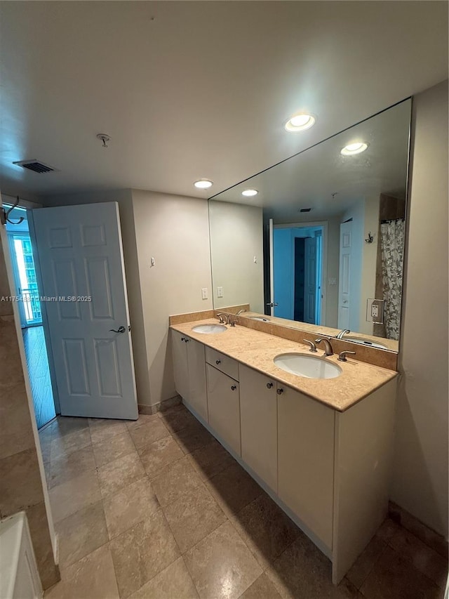 1745 E Hallandale Beach Blvd Unit 804W, Hallandale Beach, FL 33009 - full bathroom with double vanity, baseboards, and recessed lighting