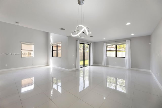 empty room featuring recessed lighting, visible vents, baseboards, and light tile patterned floors