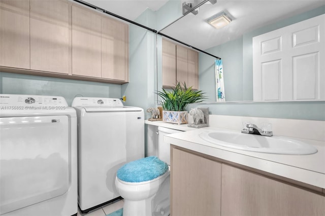 full bathroom with vanity, washing machine and dryer, and toilet