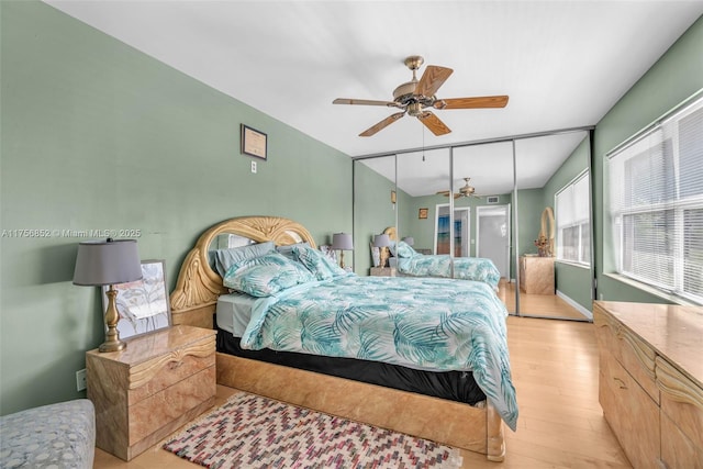 bedroom featuring light wood-style flooring and a ceiling fan