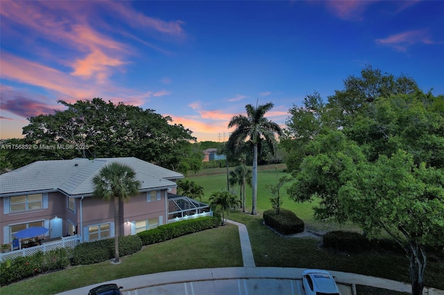 yard at dusk with a lanai