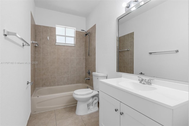 bathroom featuring shower / washtub combination, tile patterned flooring, vanity, and toilet