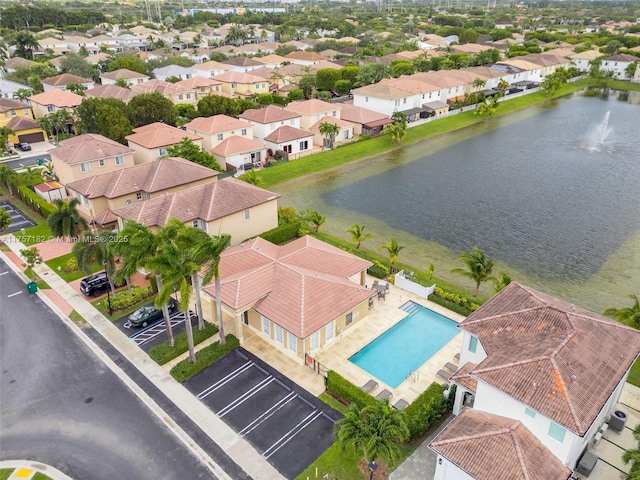 bird's eye view featuring a residential view and a water view