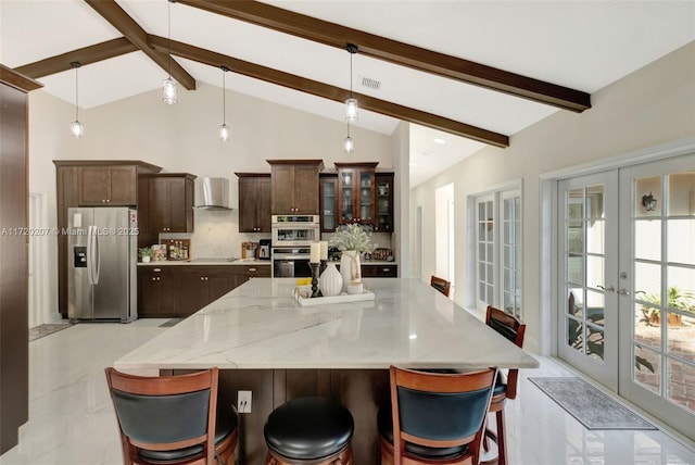 kitchen with stainless steel appliances, french doors, marble finish floor, and wall chimney exhaust hood