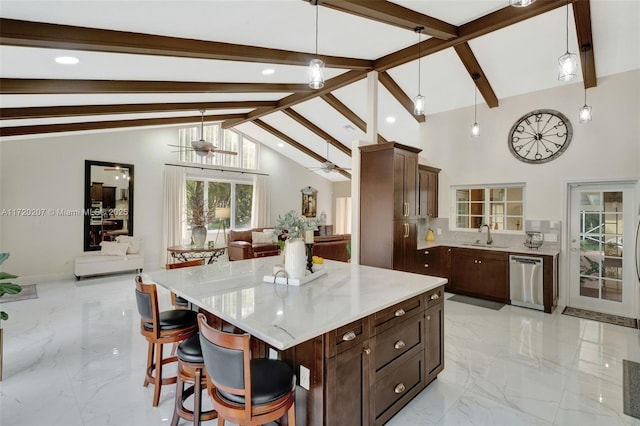 kitchen with a ceiling fan, dishwasher, open floor plan, hanging light fixtures, and marble finish floor