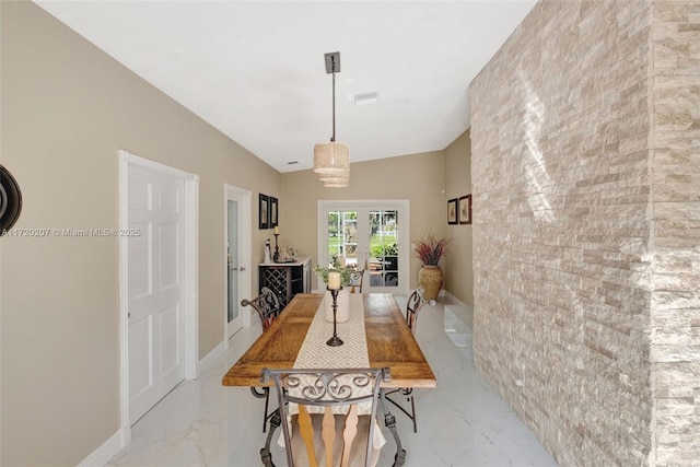 dining room featuring marble finish floor, french doors, and baseboards