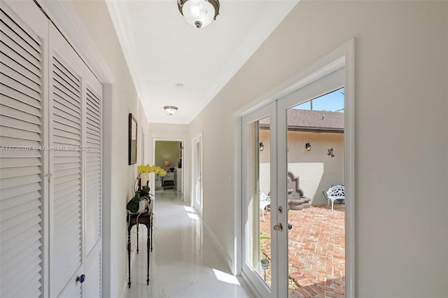 corridor featuring marble finish floor, crown molding, and french doors