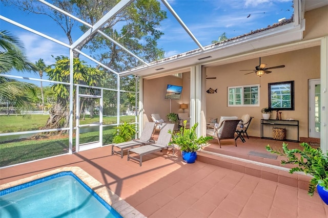 outdoor pool featuring ceiling fan, a patio, and a lanai