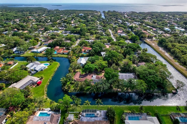 drone / aerial view featuring a water view and a residential view