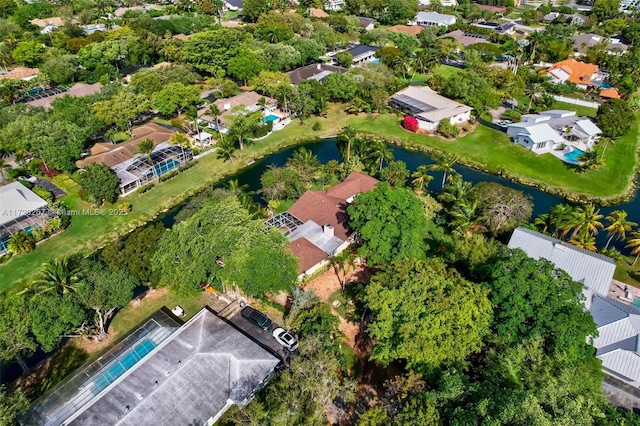 birds eye view of property featuring a water view and a residential view