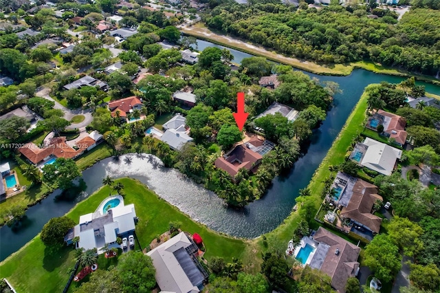 bird's eye view with a water view and a residential view