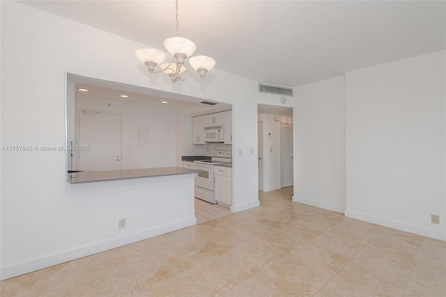 kitchen featuring white appliances, visible vents, hanging light fixtures, an inviting chandelier, and white cabinetry