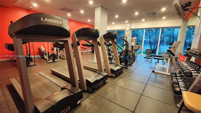 workout area featuring a drop ceiling and visible vents