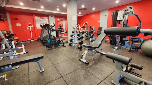 workout area featuring a paneled ceiling