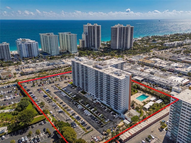 bird's eye view featuring a water view and a city view