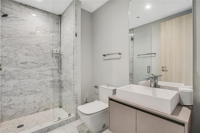 bathroom featuring recessed lighting, toilet, vanity, and a marble finish shower