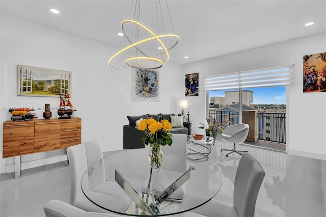 dining space featuring a chandelier and recessed lighting