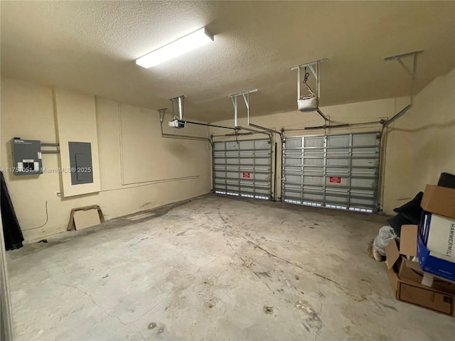 garage featuring a garage door opener and electric panel