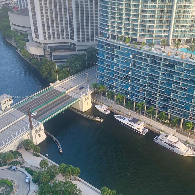 drone / aerial view featuring a water view and a city view