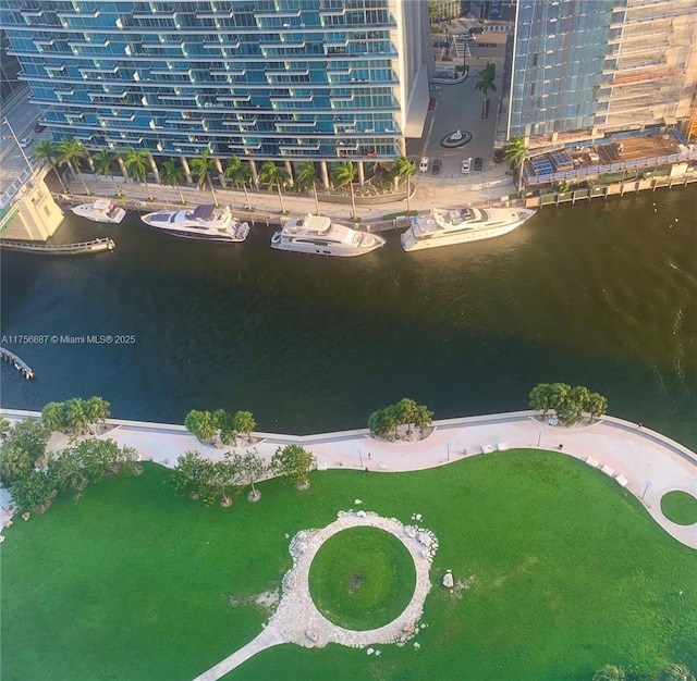 drone / aerial view featuring a water view and a city view