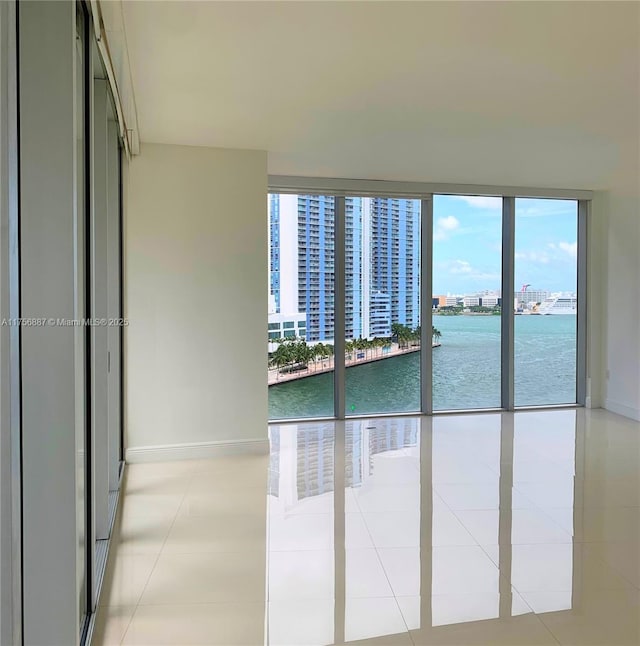 interior space with a water view and a view of city