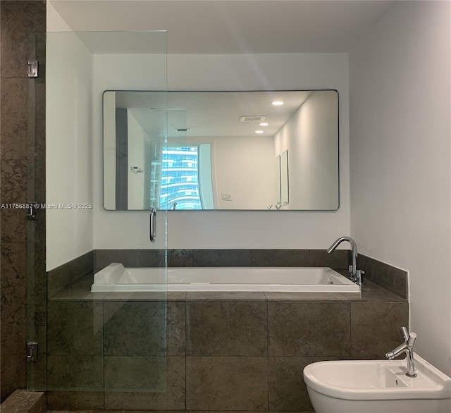 full bath featuring visible vents, an enclosed shower, a bidet, and a bath