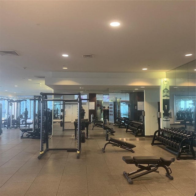 gym featuring recessed lighting and visible vents