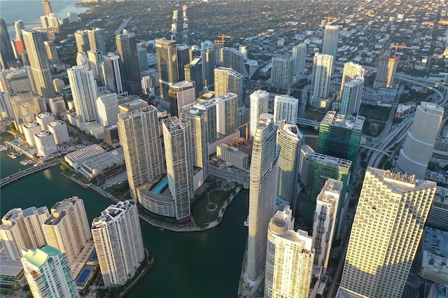 birds eye view of property featuring a water view and a city view