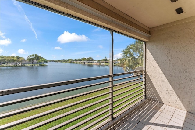 balcony featuring a water view