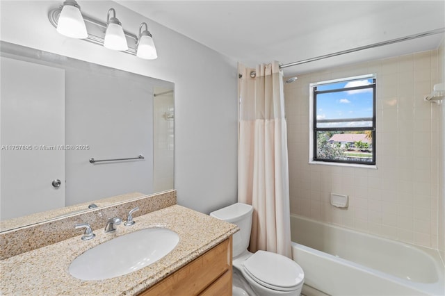 bathroom with toilet, shower / bath combo, and vanity