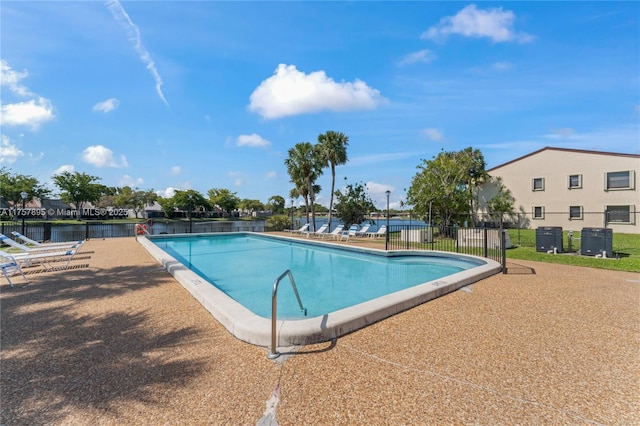 community pool featuring fence