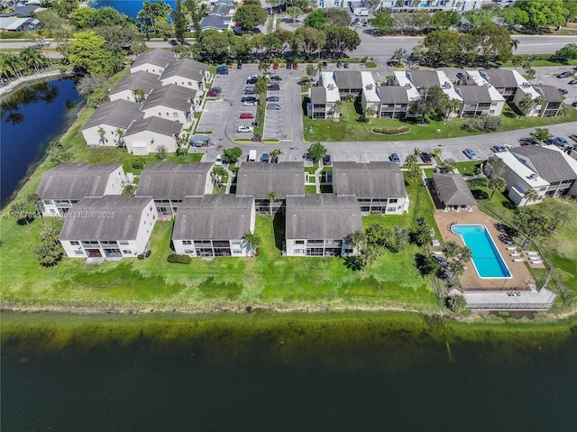 bird's eye view with a water view and a residential view