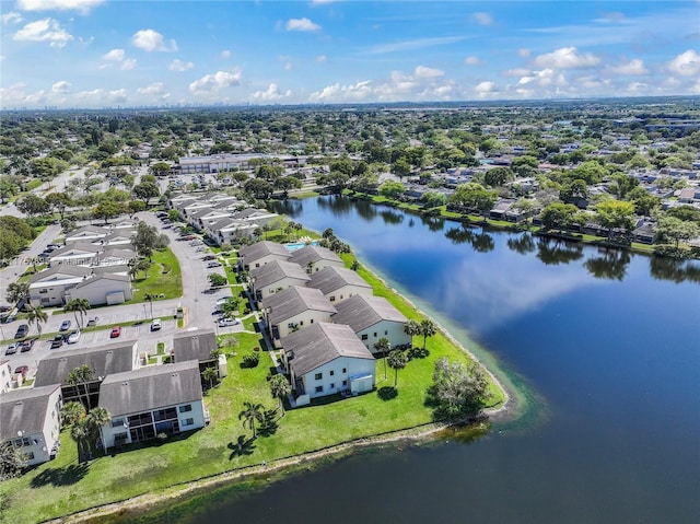 bird's eye view with a water view and a residential view