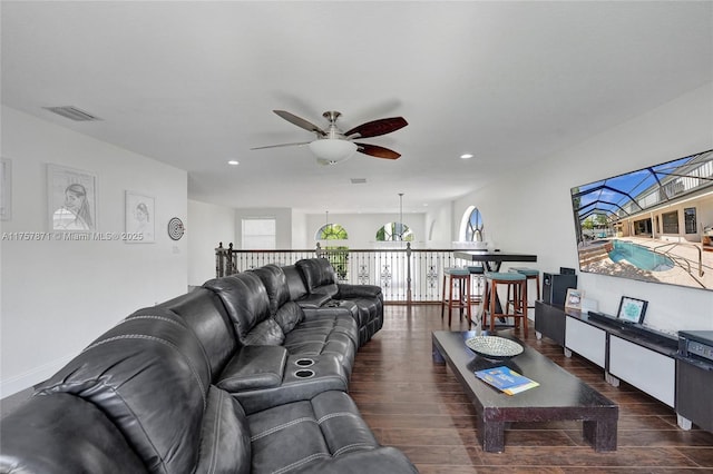 living room featuring a ceiling fan, wood finished floors, visible vents, and recessed lighting