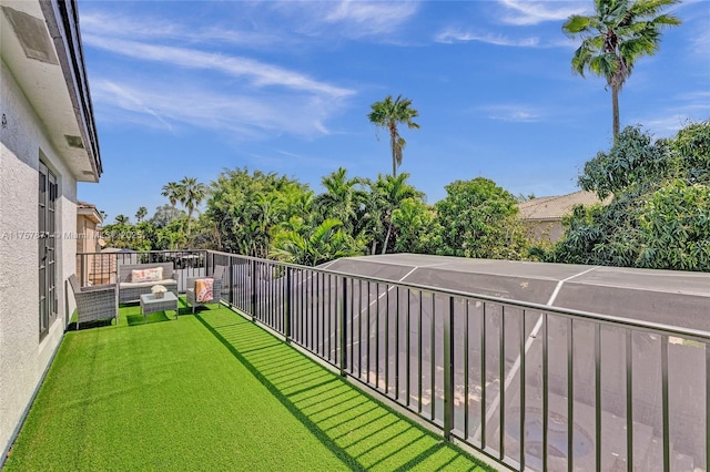 view of yard featuring a balcony