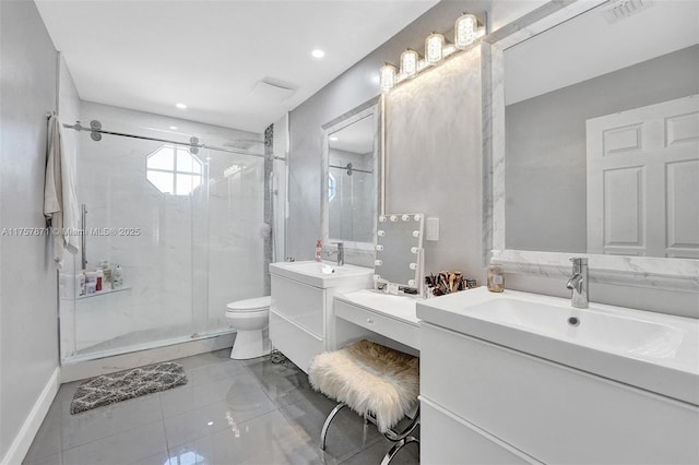 full bath featuring two vanities, visible vents, toilet, a sink, and a shower stall