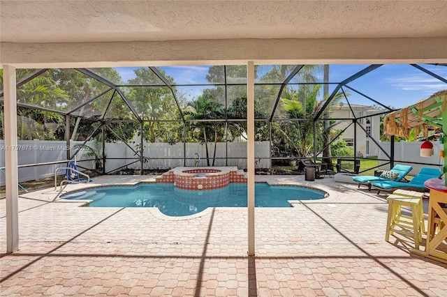 view of pool featuring a fenced backyard, a fenced in pool, a patio, and an in ground hot tub